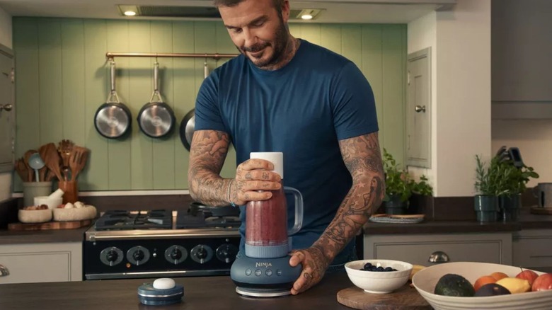 Man using Ninja BlendBOSS Tumbler system