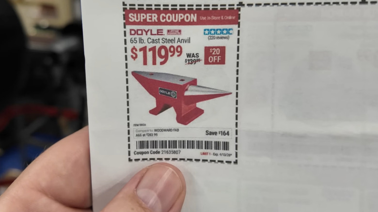 Man holding printed coupon in Harbor Freight