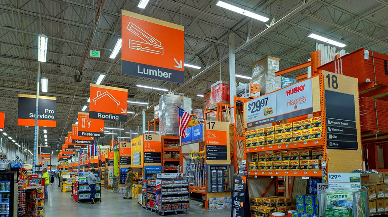 The interior of a Home Depot store showing multiple aisles