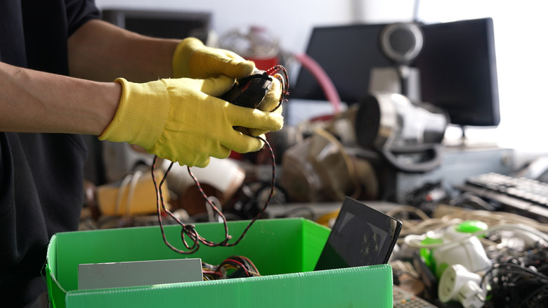 person sorting through ewaste