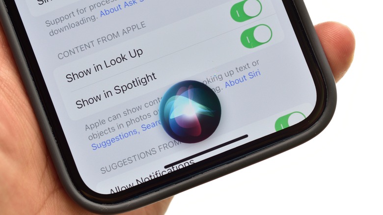 iPhone with Siri on screen