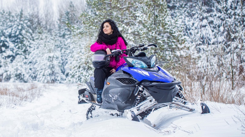 A woman on a snowmobile