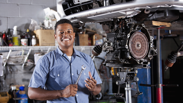 Mechanic Working On Transmission