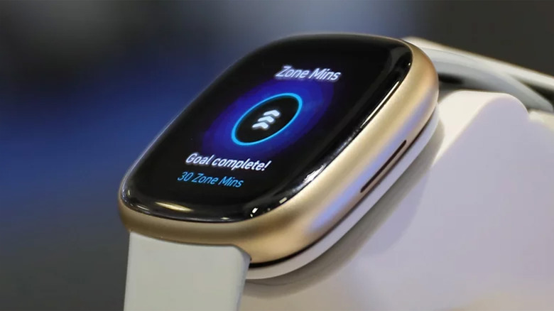 A Fitbit fitness tracker showing exercise completion