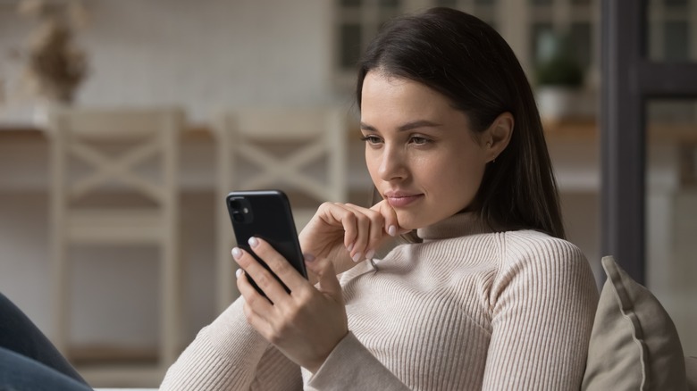 person looking at smartphone