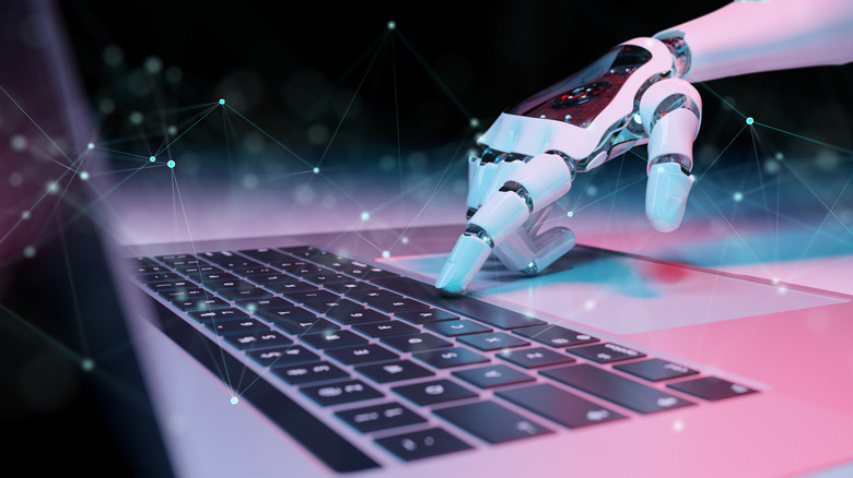 robot hand pressing keyboard keys