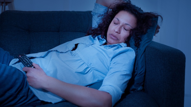 Woman asleep on couch