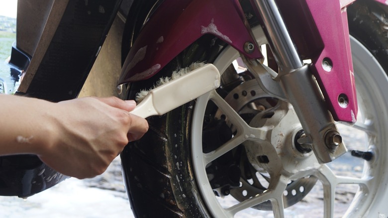 Hand scrubbing motorcycle tire