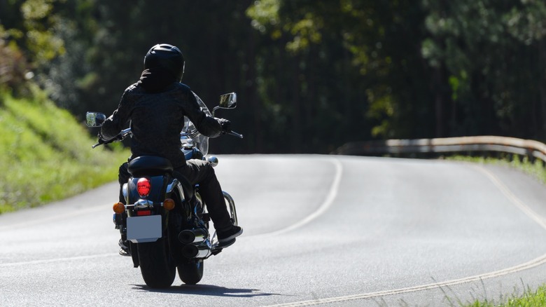 A lone motorcycle rider on the road