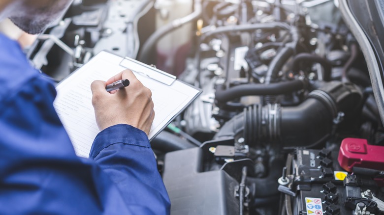 Mechanic doing an engine inspection