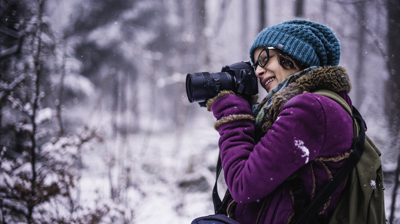 Woman using DSLR camera