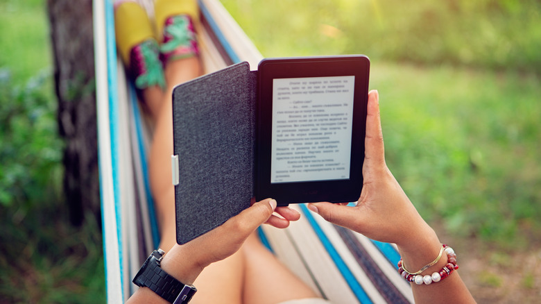 person reading in hammock