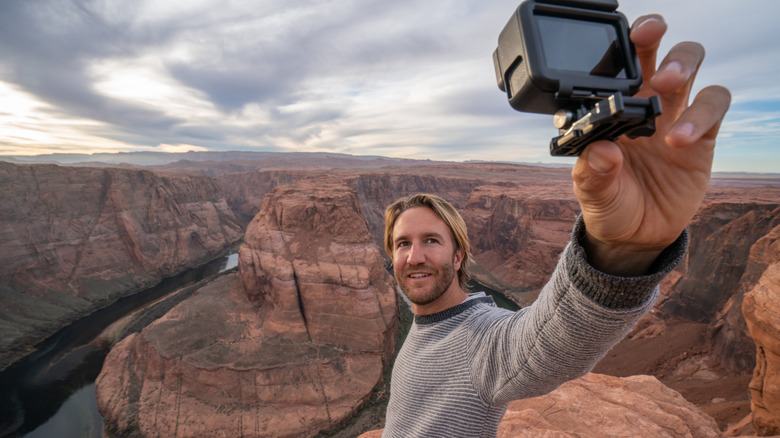 Man holding GoPro at Grand Canyon