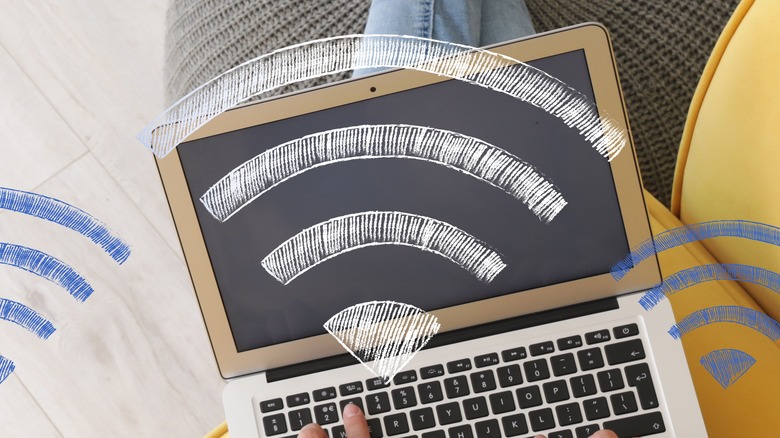 artistic rendition of Wi-Fi signal reaching a person's laptop