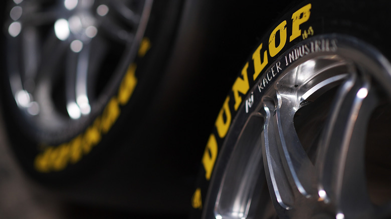 A close up shot of a Dunlop tire - which Sumitomo purchased from Goodyear in January 2025