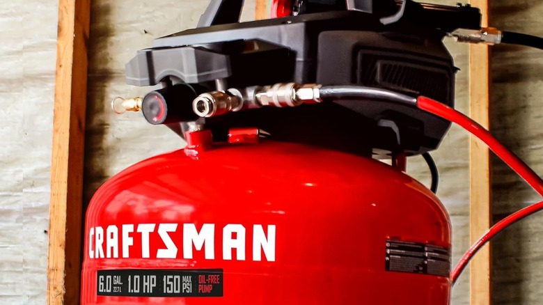 A red Craftsman air compressor tank.