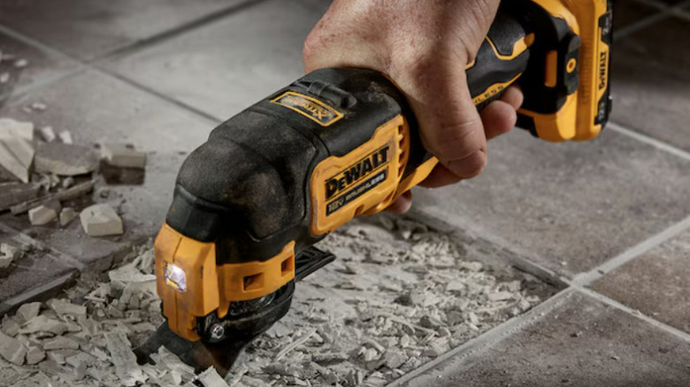 DeWalt oscillating tool being used on tile