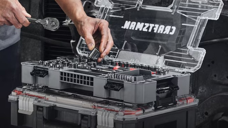 Person taking socket from Craftsman Overdrive 80-piece set