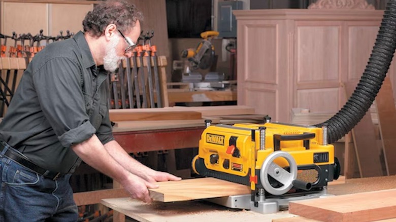 DeWalt 13-inch, 3-Knife, 2-Speed Planer in use