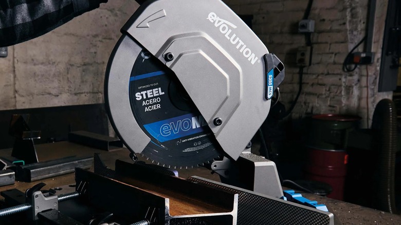 An Evolution mitering chop saw on a table.