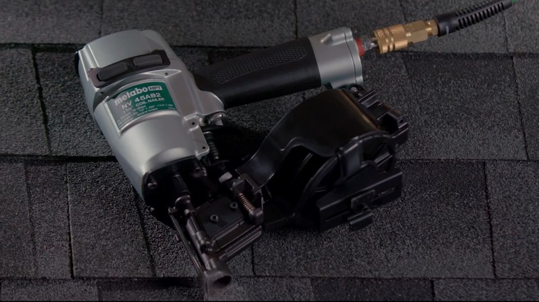 A Metabo HPT roofing nailer on shingles.