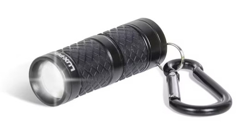 Lux-Pro LP130 flashlight on white background.