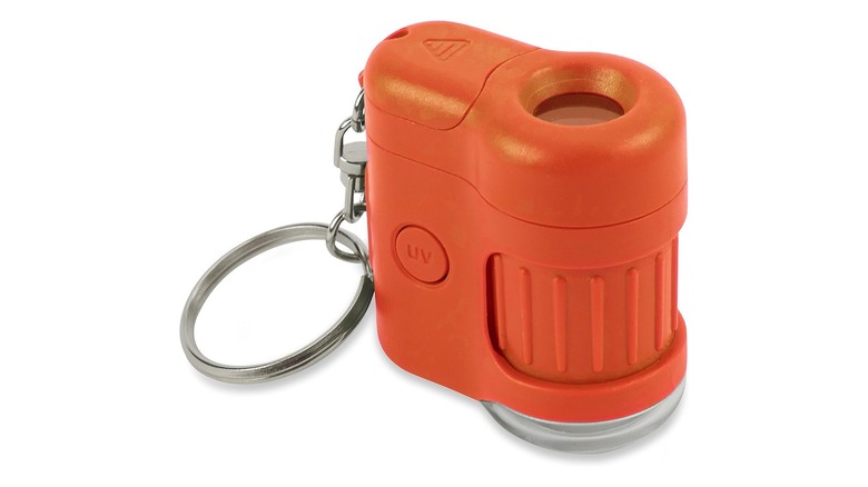 Orange keychain-sized microscope