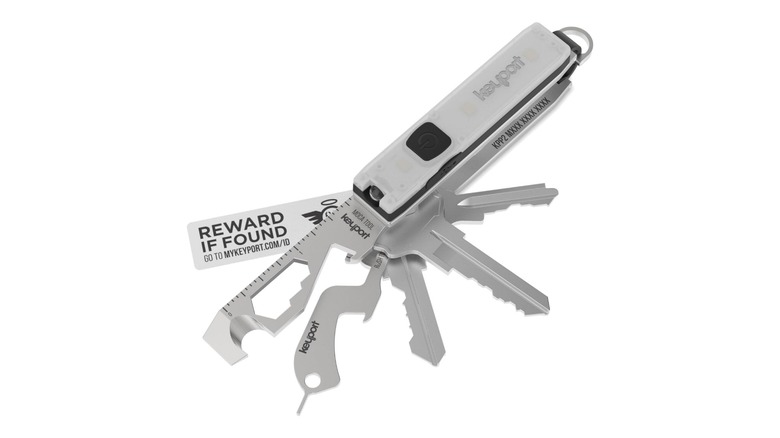 Silver keychain accessory feature multiple keys and multitools