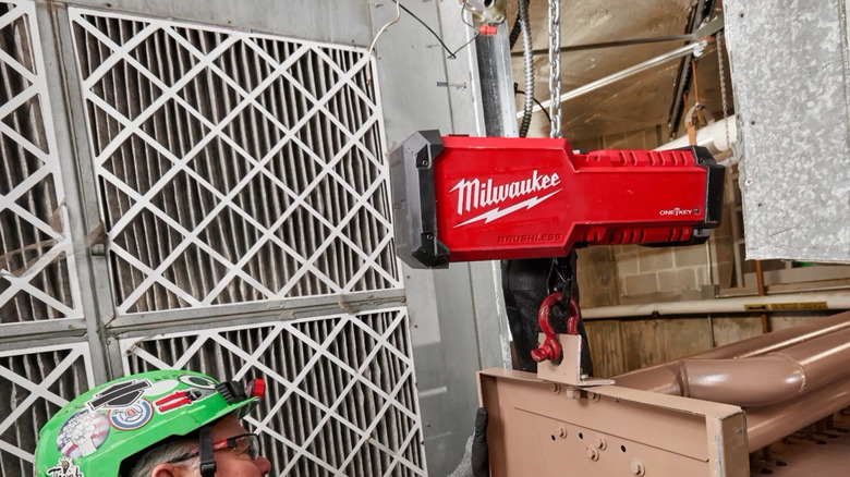 Milwaukee chain hoist carrying metal load while being controlled remotely