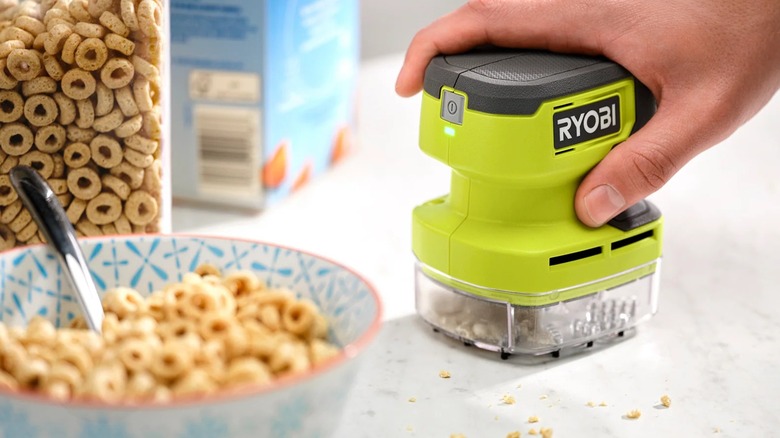 Ryobi USB Lithium Desktop Vacuum cleaning up cereal crumbs