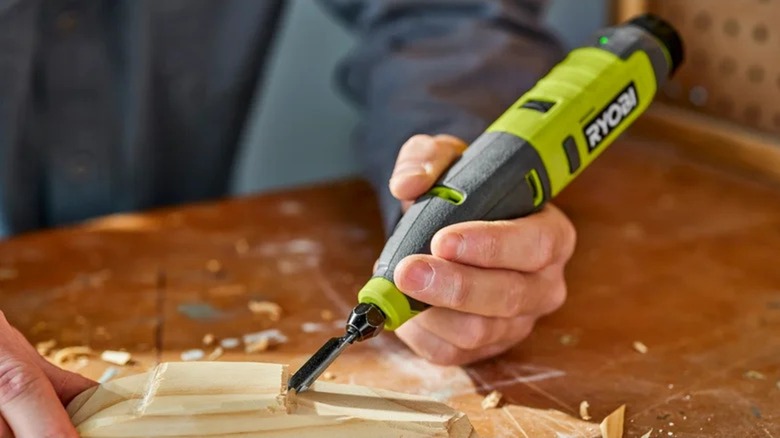 Person using aRyobi USB Lithium Power Carver on wood