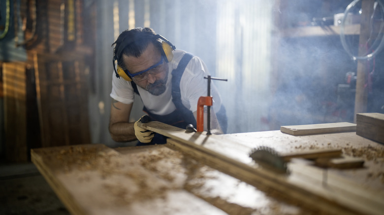 woodworker wearing eye and ear protection