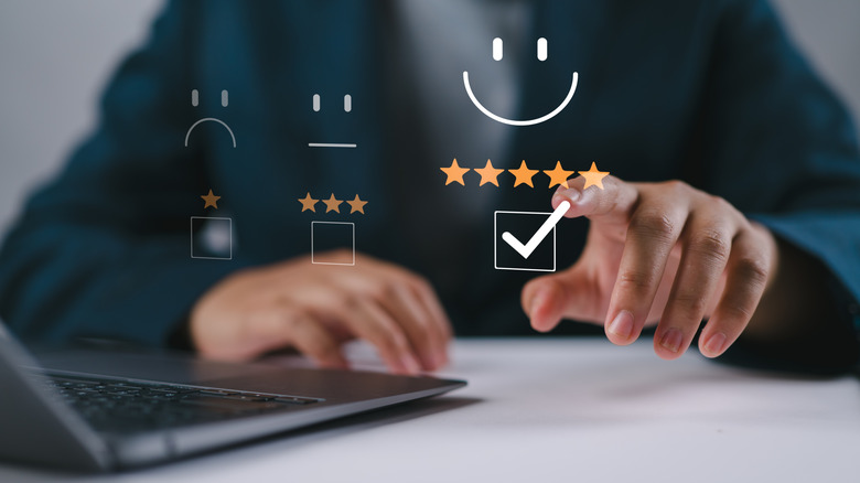 Finger pointing at a holographic 5-star review
