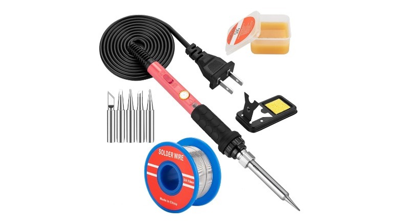 Soldering iron with black cable, tips, stand and other accessories