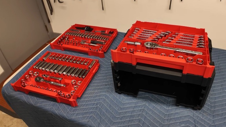 Craftsman Versastack 242-piece Metric and Standard Mechanics Tool Set with Hard Case laid out on a table