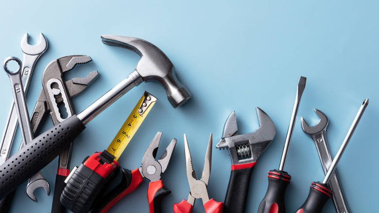 different hand tools on table