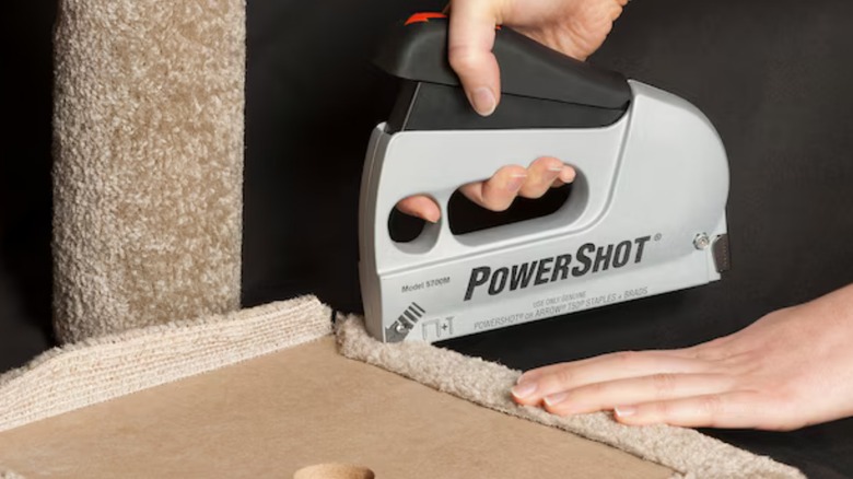 a person using the powershot staple gun