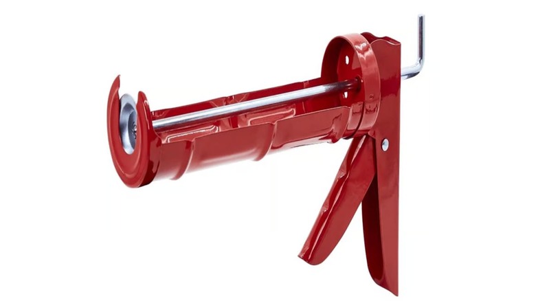 The Newborn caulking gun on a white background.