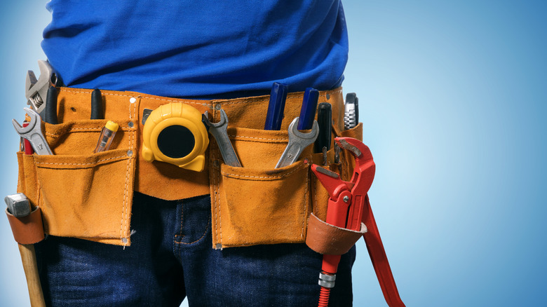 closeup of a toolbelt on handyman