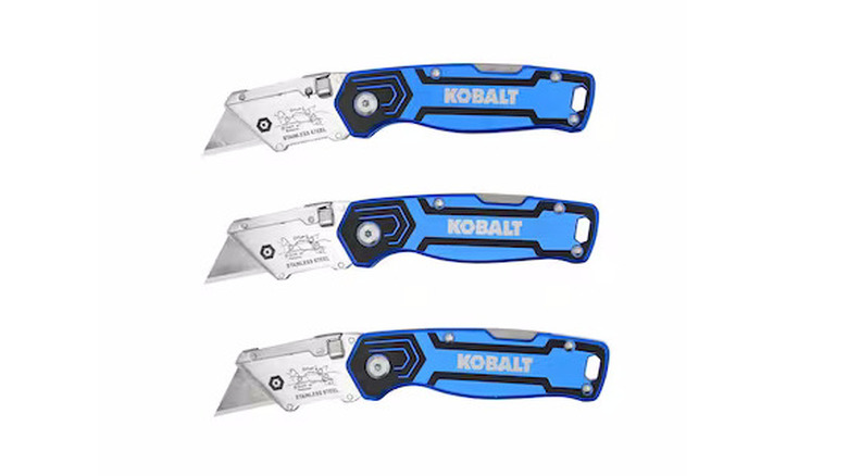Three Kobalt folding knifes with a blue and black handle on a white background