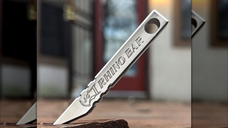 close up of rhino bar with the point embedded in a table