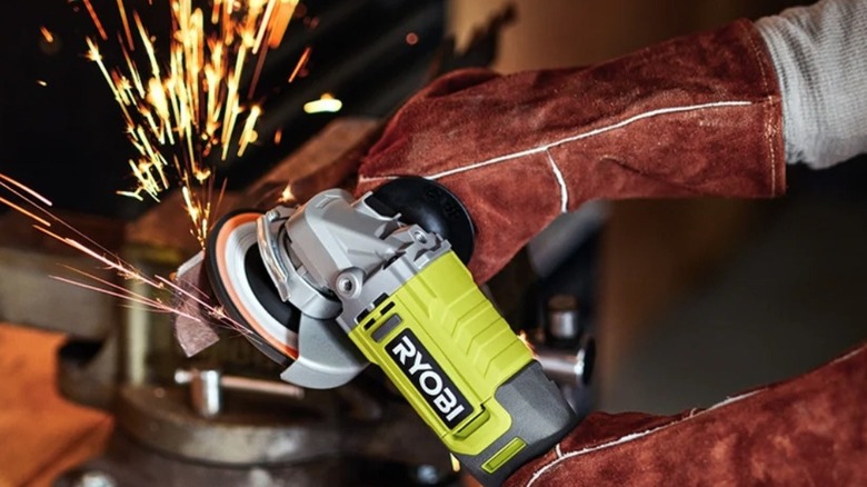 Person using a Ryobi grinder
