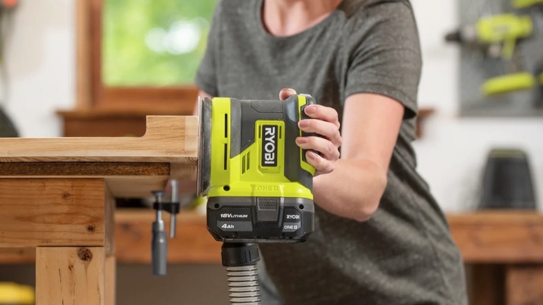 Person using Ryobi Orbit Sander