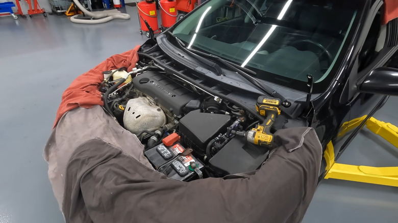 2012 Toyota Corolla XRS with the hood removed, during engine removal.