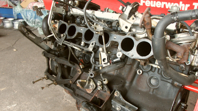 A Toyota 7M turbo engine taken out of a car, left side.