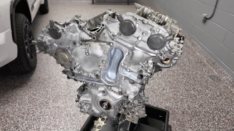 Toyota V35A-FTS engine block in a garage.