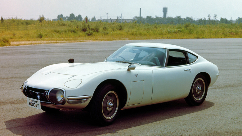 Toyota 2000GT parked on empty lot