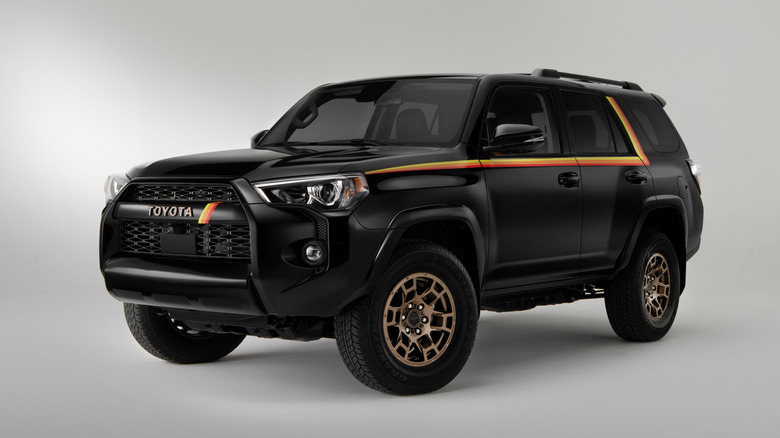 Front three-quarter view of black 2023 Toyota 4Runner parked in studio.