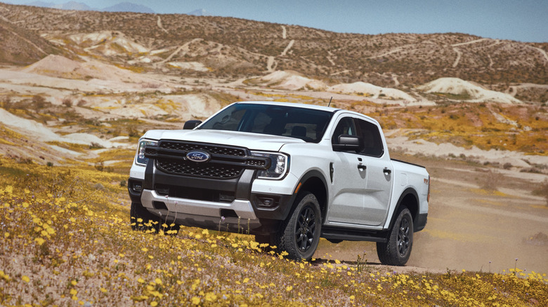 White 2026 Ford Ranger driving in desert