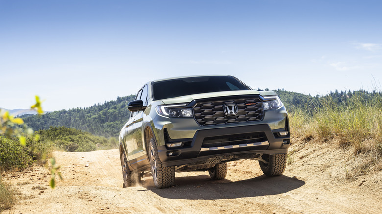 2026 Honda Ridgeline driving in sandy terrain, front-view